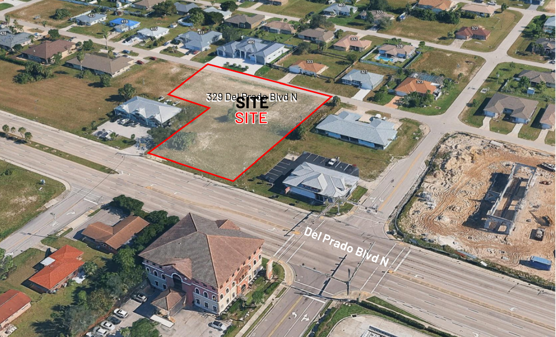 Aerial view outlining the 1.25-acre commercial property at 329 Del Prado Boulevard North