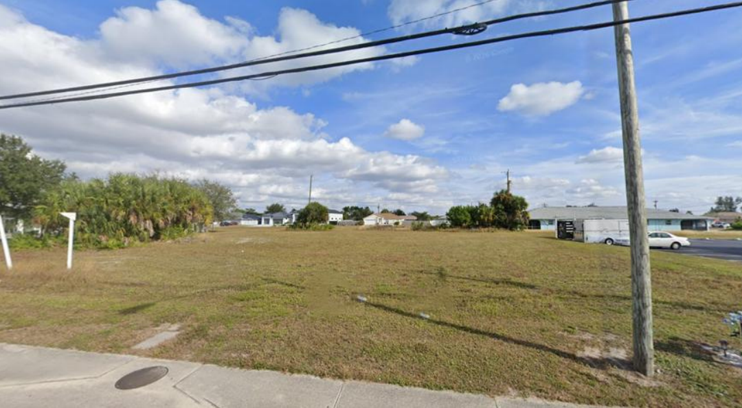 East view of the vacant land from Del Prado Boulevard North